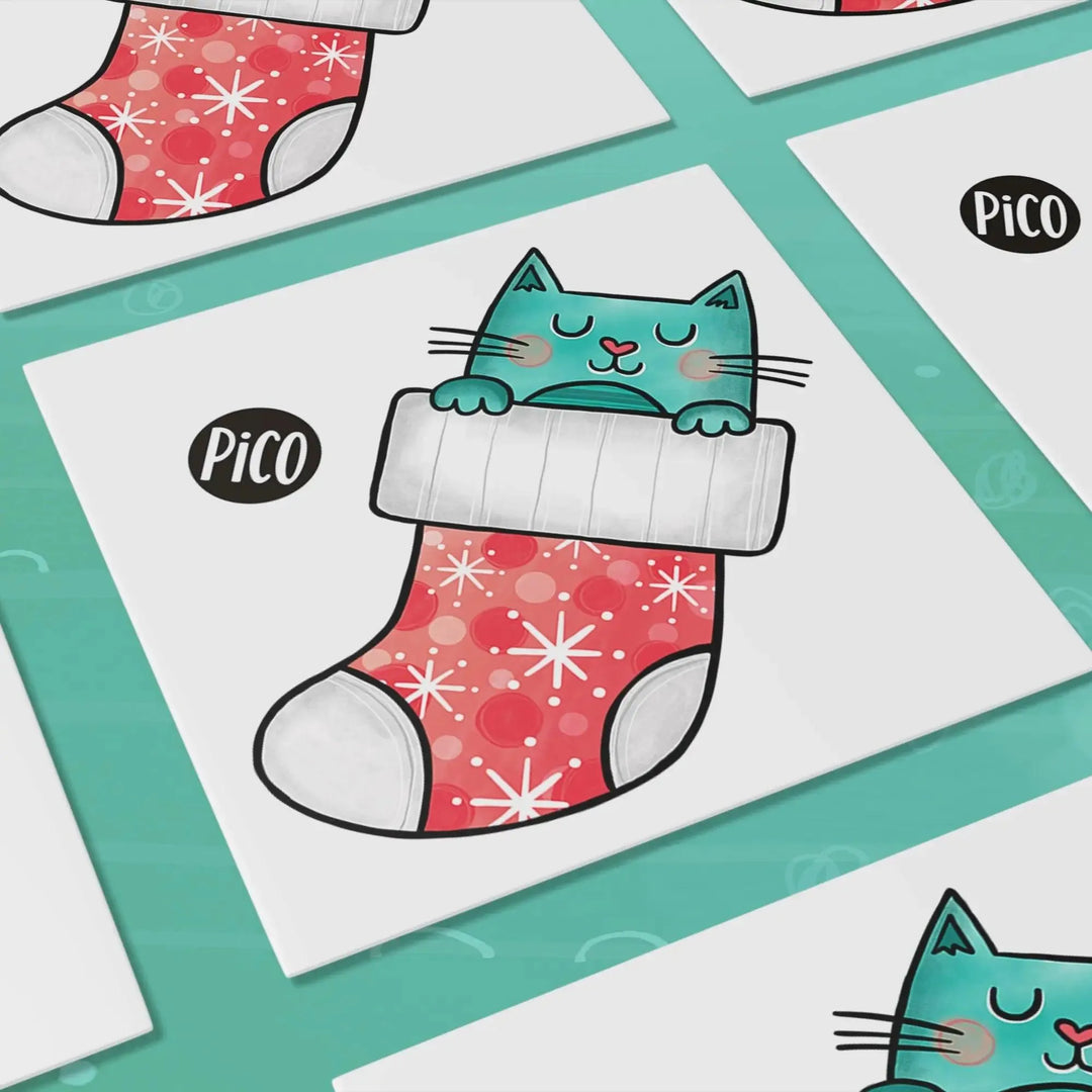 Tatouages temporaires en vrac du chat dans un bas par PiCO Tatouages temporaires. Design réalisé au Québec. / Bulk temporary tattoos of the Christmas stocking cat by PiCO Temporary Tattoos. Design made in Canada.